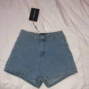 prettylittlething light wash high waisted shorts